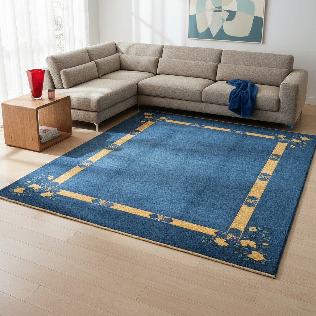 Tappeto moderno 284x213 cm Persia con fondo blu e cornice gialla decorata da fiori stilizzati, annodato a mano in lana naturale.