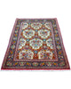 Tappeto Qom avorio 164x107 cm con disegni floreali in salotto raffinato