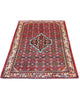 Tappeto Hamedan rosso 150x105 cm con disegno tradizionale in salotto
