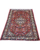 Tappeto Hamedan rosso 174x112 cm con disegno tradizionale in salotto