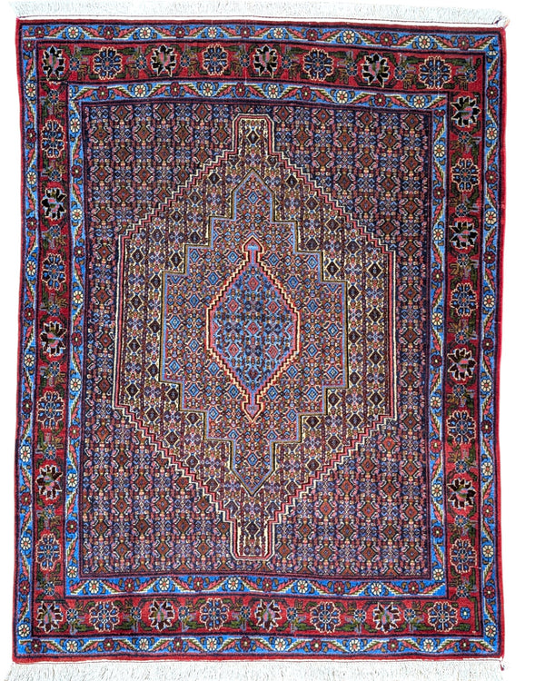 Tappeto Sanneh multicolore 163x123 cm con disegno geometrico in salotto