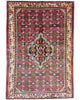 Tappeto persiano 150x105 cm rosso con medaglione geometrico in soggiorno elegante