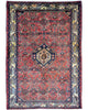 Tappeto persiano 150x105 cm rosso con medaglione geometrico in soggiorno elegante