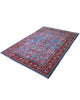 Tappeto persiano elegante con motivi floreali e bordura decorativa