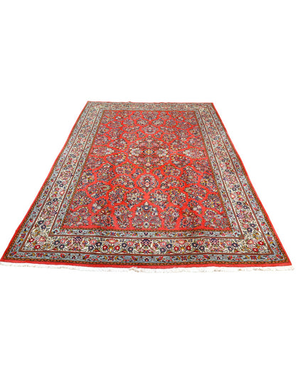 "Tappeto Saruk persiano rosso corallo con motivi floreali e bordura avorio e blu, 312x200 cm, annodato a mano."