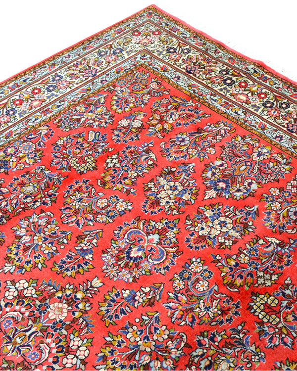 "Tappeto Saruk persiano rosso corallo con motivi floreali e bordura avorio e blu, 312x200 cm, annodato a mano."