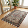 Tappeto Transilvania 180x130 cm annodato a mano, rettangolare, in lana e cotone, fondo avorio con medaglione centrale marrone e motivi floreali in verde, azzurro e rosso.
