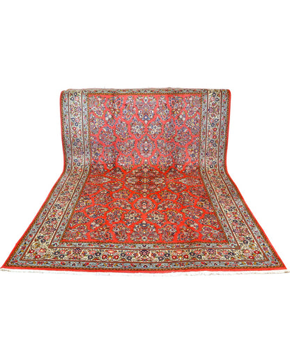 "Tappeto Saruk persiano rosso corallo con motivi floreali e bordura avorio e blu, 312x200 cm, annodato a mano."