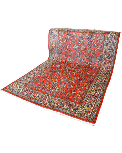 "Tappeto Saruk persiano rosso corallo con motivi floreali e bordura avorio e blu, 312x200 cm, annodato a mano."