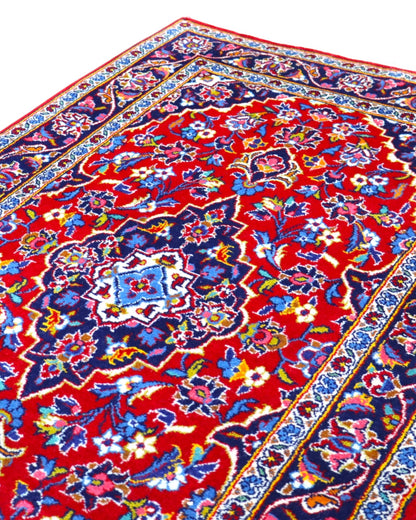 tappeto kashan persiano fatto a mano fondo rosso con medaglione floreale centrale
