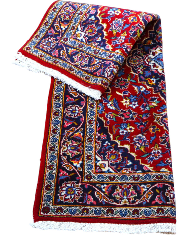 tappeto kashan persiano fatto a mano fondo rosso con medaglione floreale centrale