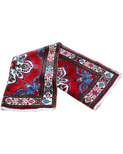Tappeto Hamedan persiano 167x100 cm annodato a mano, fondo rosso con motivi floreali avorio e dettagli blu, design tradizionale con medaglioni simmetrici