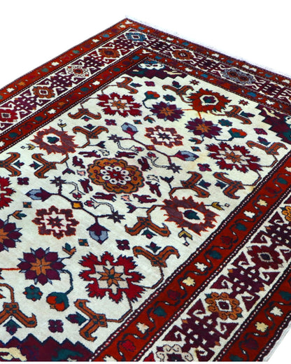 Tappeto Kazak caucasico 130x109 cm annodato a mano, fondo avorio con motivi geometrici e floreali colorati