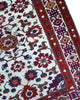 tappeto kazak caucasico fatto a mano fondo avorio con motivi geometrici colorati