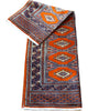 Tappeto Bokhara 151x95 cm annodato a mano, fondo arancio con medaglioni geometrici ripetuti e dettagli beige e blu