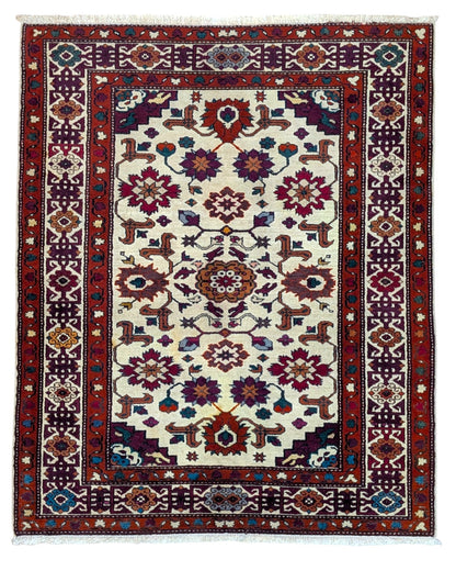 Tappeto Kazak caucasico 130x109 cm annodato a mano, fondo avorio con motivi geometrici e floreali colorati