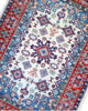 Tappeto Kazak 144x102 cm con dettagli geometrici e fiori, perfetto per camera da letto.