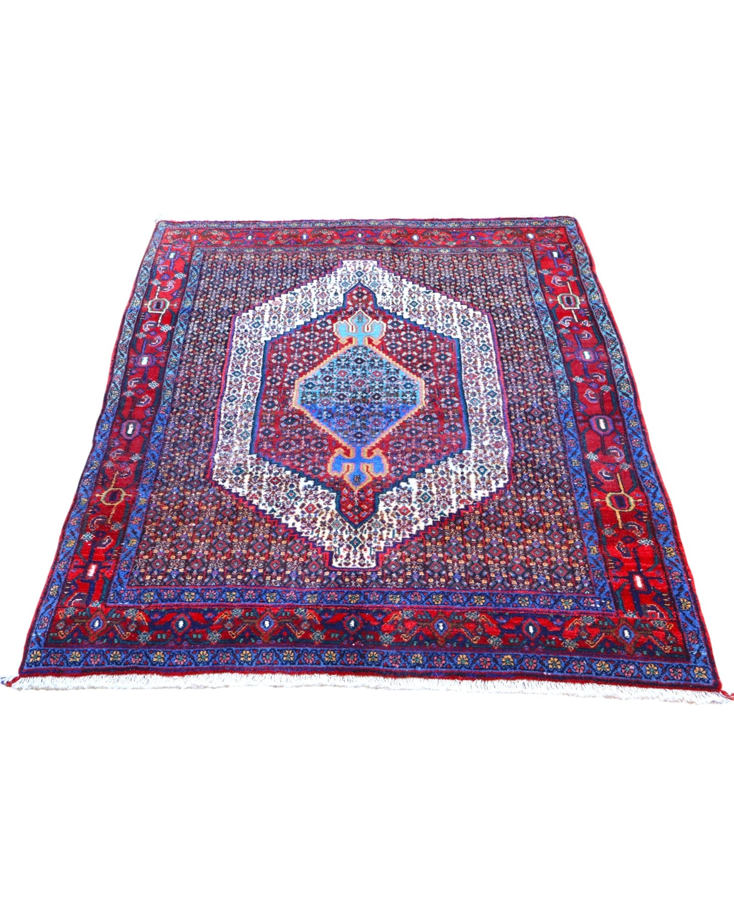 Tappeto Sanneh multicolore 161x131 cm con disegno geometrico in salotto
