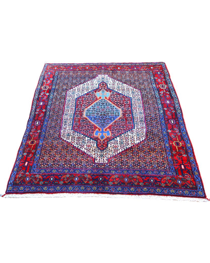 Tappeto Sanneh multicolore 161x131 cm con disegno geometrico in salotto