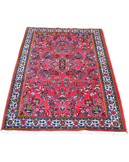Tappeto Saruk rosso 167x108 cm con disegni floreali in salotto raffinato