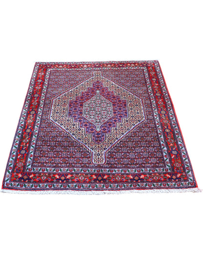 Tappeto Sanneh multicolore 154x127 cm con disegno geometrico in salotto
