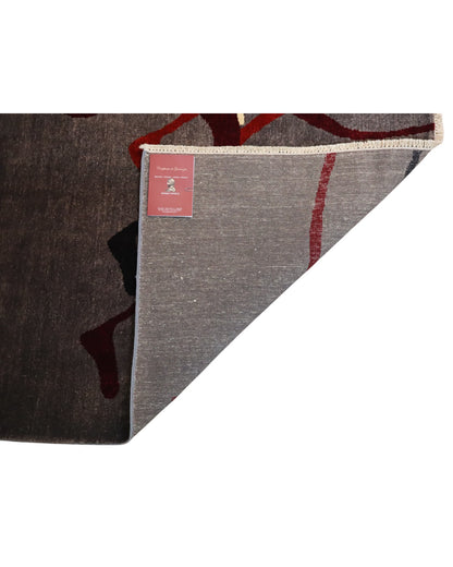 Tappeto moderno “Cavalli Preistorici” 240x280 cm di Dario, annodato a mano, cavalli stilizzati ispirati all’arte rupestre su fondo grigio, lana tinta vegetale, pezzo unico.