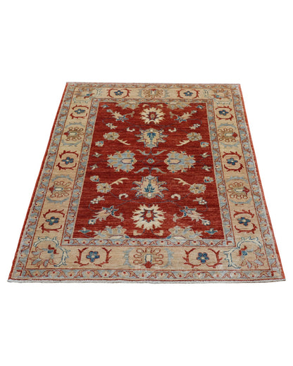 Tappeto floreale annodato a mano 150x102 cm dall’Afghanistan, fondo rosso mattone con motivi floreali beige, blu e marrone chiaro, bordura beige decorata.